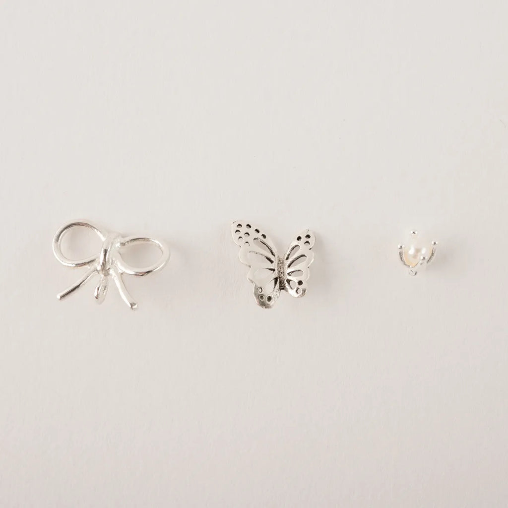 Stekertjes in zilver: strikje, parel, vlinder...